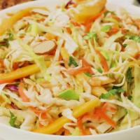 Jamaican Slaw · Shredded green cabbage, red cabbage, carrot, and scallion in a sweet citrus vinaigrette.