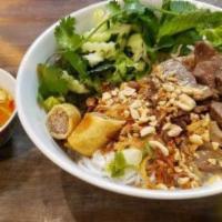 Bún Bò Xào Nam Bộ · Satay beef, an eggroll, vermicelli noodles, herbs, lettuce, beansprouts and a homemade fish ...