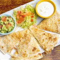 King Quesadilla · Large quesadilla with side of sour cream and guacamole