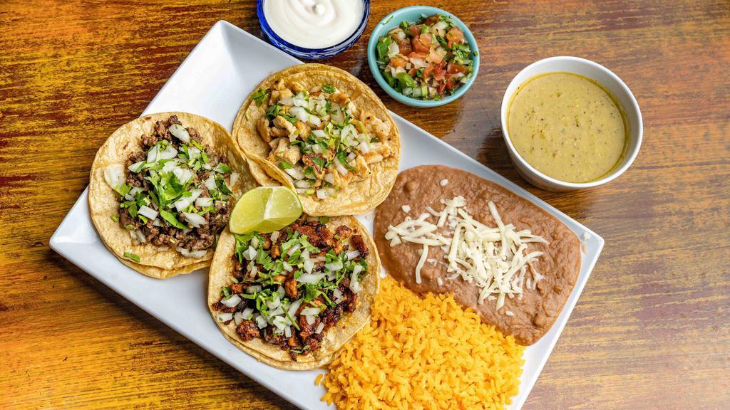 Taco Dinner - 2 Tacos · Steak, pork, chicken or beef. Served with rice, beans, lettuce, tomato and tortillas.