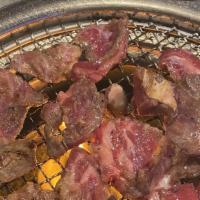 Kalbi · Sliced premium beef ribs marinated in soy sauce, garlic, sesame oil, and variety of other Ko...