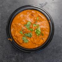 Butter Chicken · Boneless chicken pieces cooked in herbs and spices with chopped tomato and butter.