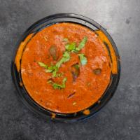 Chicken Tikka Masala · Chicken cooked in rich tomato and onion gravy with touch of cream.