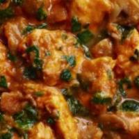 Chicken Saag · Chicken cooked with spinach with touch of cream.