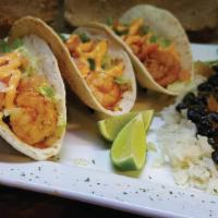 Baja Shrimp Tacos · Three corkscrew shrimp tacos, salsa verde  cilantro-lime creme, habanero pickled red onion, ...