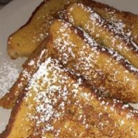 Traditional French Toast · Dusted with powdered sugar.