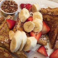 The House French Toast · Fresh strawberries, bananas and pecans.