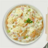 Mashed Potatoes · Mashed Idaho potatoes cooked, seasoned with garlic, butter, and topped with crispy bits of b...