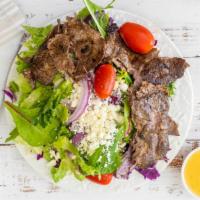 Steak Salad · Mixed greens, red onion, tomato, feta cheese, grilled steak, italian dressing.