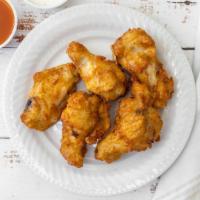 Chicken Wings · 10 fried chicken wings tossed in buffalo sauce.