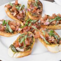 Bruschetta · Toasted Italian bread points, topped with fresh basil and marinated roma tomatoes