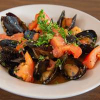Mussels Pomodoro · Steamed mussels in white wine, with fresh tomato basil garlic sauce