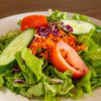 House Salad · Crisp romaine lettuce with red cabbage, shaved carrots, cucumber and tomato wedge. Choice of...