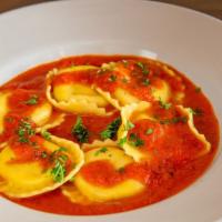 Ravioli Portobello · Ravioli stuffed with portobello mushrooms, tossed with fresh spinach, tomatoes, extra virgin...