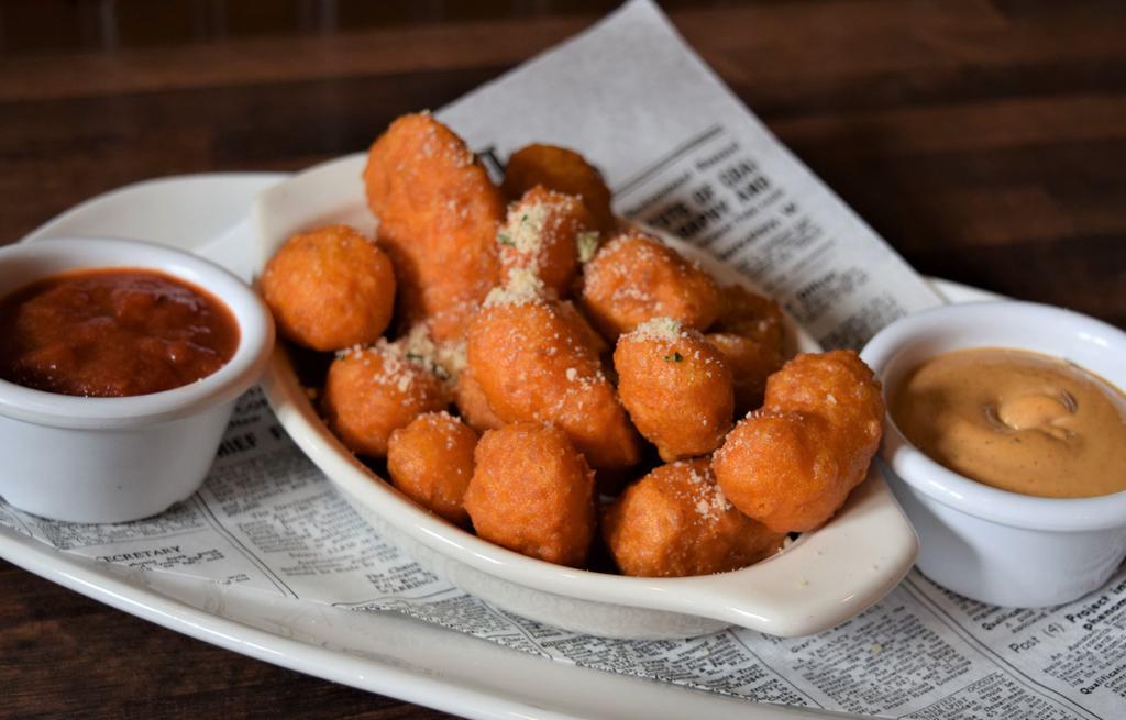Leinie'S Battered Cheese Curds · Leinenkugel's  beer battered and fried white cheddar curds, house marinara, Saz's Spicy White BBQ