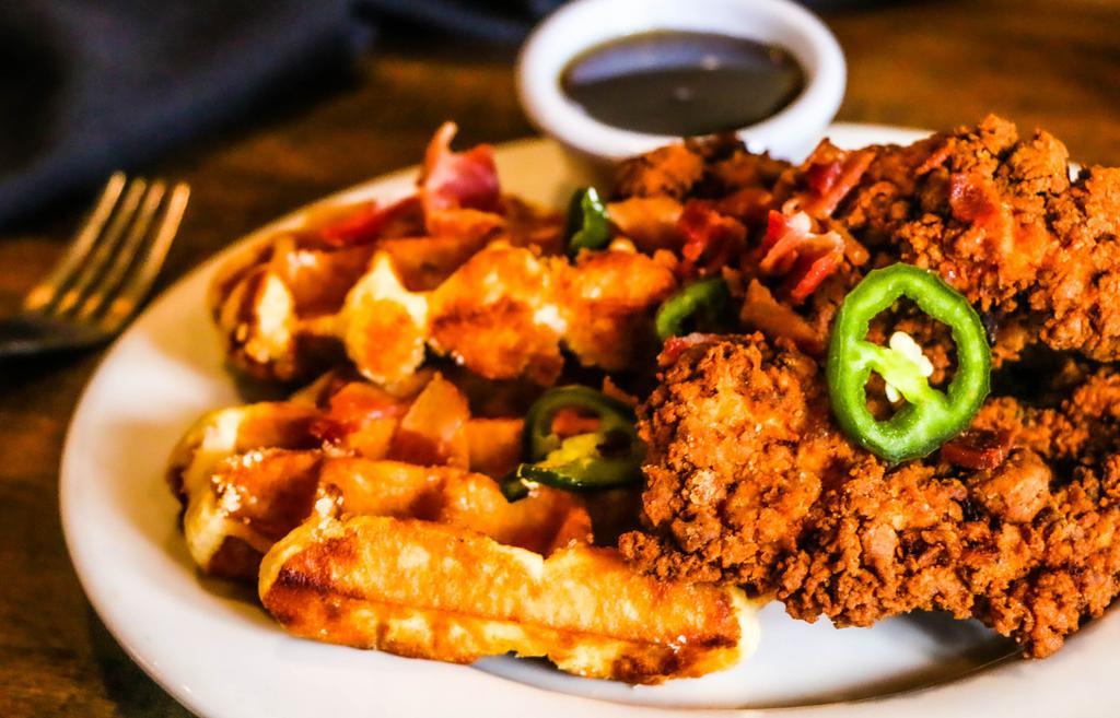 Chicken & Waffles · Belgian waffles, your choice of Nashville hot or original buttermilk fried chicken, cherrywood smoked bacon, house-pickled jalapenos, maple syrup.