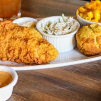 Cornmeal Catfish Dinner · Cornmeal crusted catfish filet with a side of cajun remoulade. Served with mac n cheese, col...