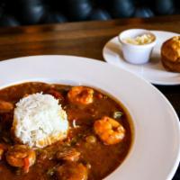Shrimp And Andouille Gumbo · Shrimp and andouille sausage in a dark roux broth with steamed rice. Served with a cornbread...
