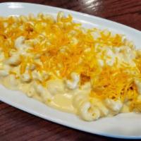 Kids Mac N Cheese · Cavatappi noodles in a cheese sauce topped with shredded cheddar.