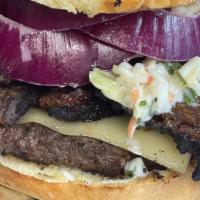 Ruth N' Chris'  Burger · A 1/2 lb of Angus Chuck, topped with 1/4 lb. of smoked Angus brisket, cole slaw, Pepper Jack...