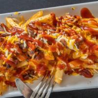 Aj'S Smothered Brisket Fries · These fries are loaded with brisket, shredded cheese and out smothered in our house made ble...