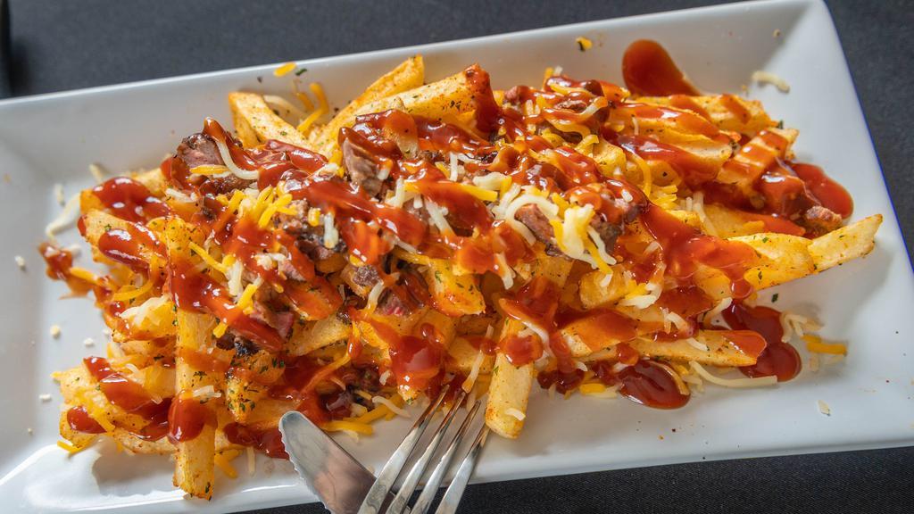 Aj'S Smothered Brisket Fries · These fries are loaded with brisket, shredded cheese and out smothered in our house made blended sauce.
