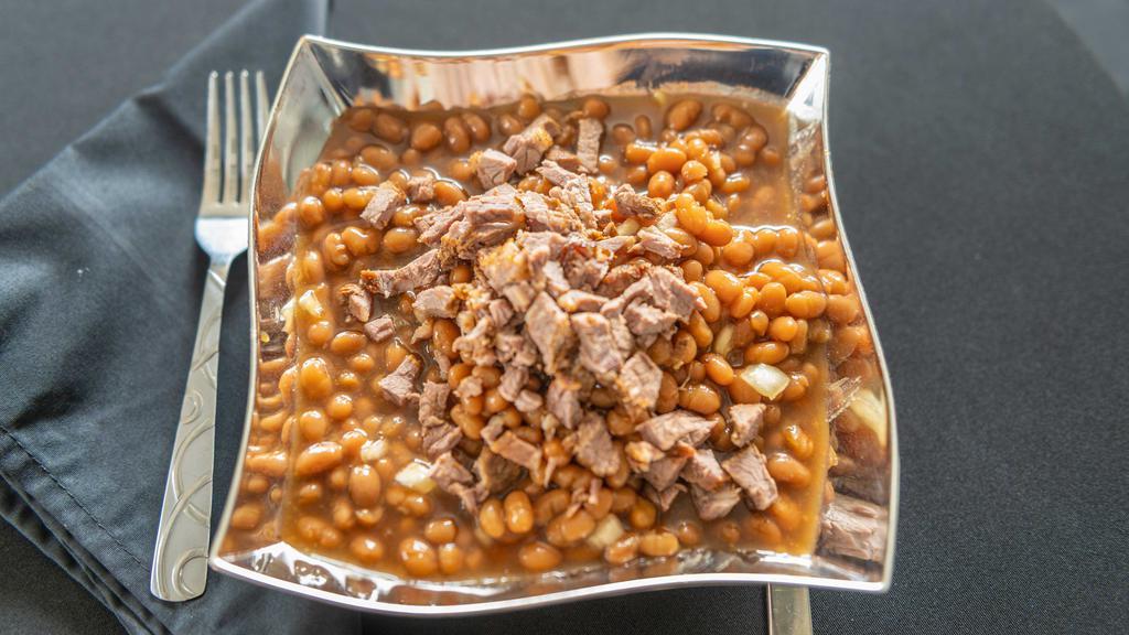 Baked Beans With Smoked Meat (8Oz.) · Baked beans are prepared with delicious burnt end brisket, fresh garlic and spices... delicious as a side or meal.