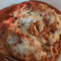 Lasagna · Layers of fresh pasta with a blend of cheese and ground beef, baked with meat sauce and mozz...