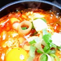 Soondubu · Spicy soft tofu soup with diced vegetables and egg in anchovy broth