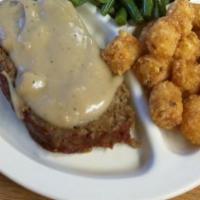 Homemade Meatloaf · Smothered in gravy.
