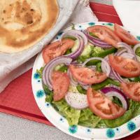 Large Garden Salad · Tomatoes, cucumbers, green peppers, red onions over romaine lettuce.