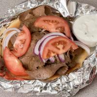 Gyros Sandwich · Served on pita bread with onions, tomatoes and white sauce.