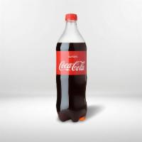 Soda Bottle (2 Lts) · Bottled soda with your choice of flavor!