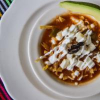 Sopa Azteca · Strips of corn tortilla sauteed in a tomato base broth, seasoned with epazote. Served with s...