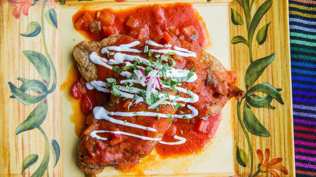 Chile Relleno Dinner · The season's premium poblano peppers stuffed with cheese. Topped with zesty tomato sauce and sour cream. Served with rice and beans. Complimentary 8oz sopa de fideo provided with this item!