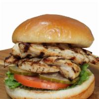 Grilled Chicken Sandwich · Our fresh marinated grilled chicken sandwich on bun.
Topped with mayo, lettuce, tomato, and ...