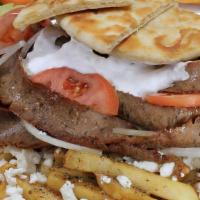 Flipped Gyros · Our MASSIVE creation
The Flipped Gyros
A huge portion of fries smothered in 
Greek dressing ...