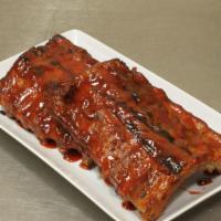 Bbq Ribs · Our tender homemade BBQ Ribs.
Available in Full, Half, or Quarter slab.
Dinners come with a ...