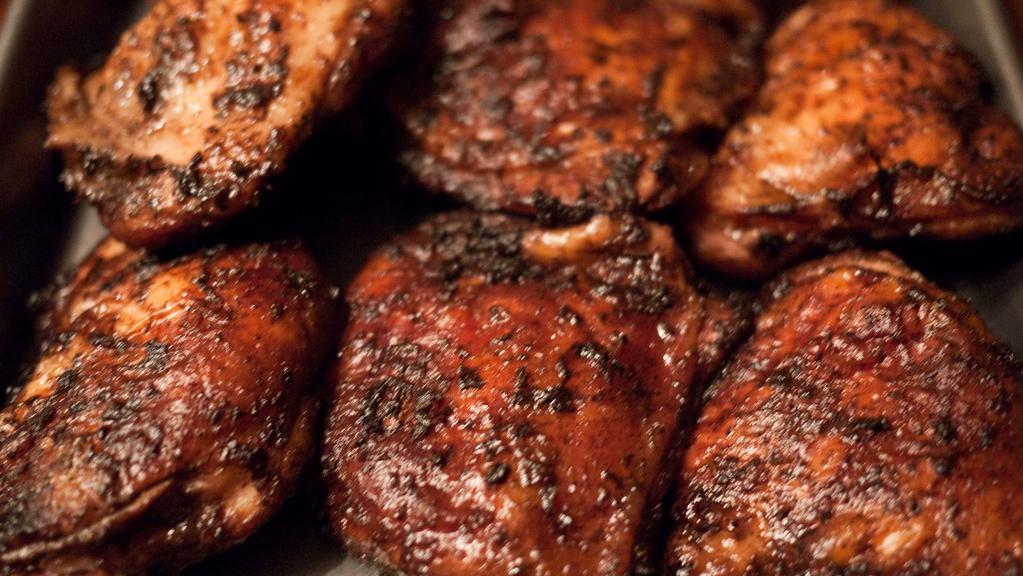 Jerk Chicken Dinner · Grilled chicken with Jamaican Jerk Sauce served with cole slaw, white bread & your choice of baked beans or seasoned waffle fries.