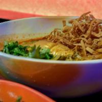Khao Soi · coconut milk curry noodle soup, braised chicken leg, pickled mustard greens, green onion, ci...