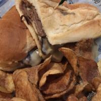 Detroit'S French Dip · Thinly slice roast beef topped with melted swiss cheese served on a grilled sub bun with one...