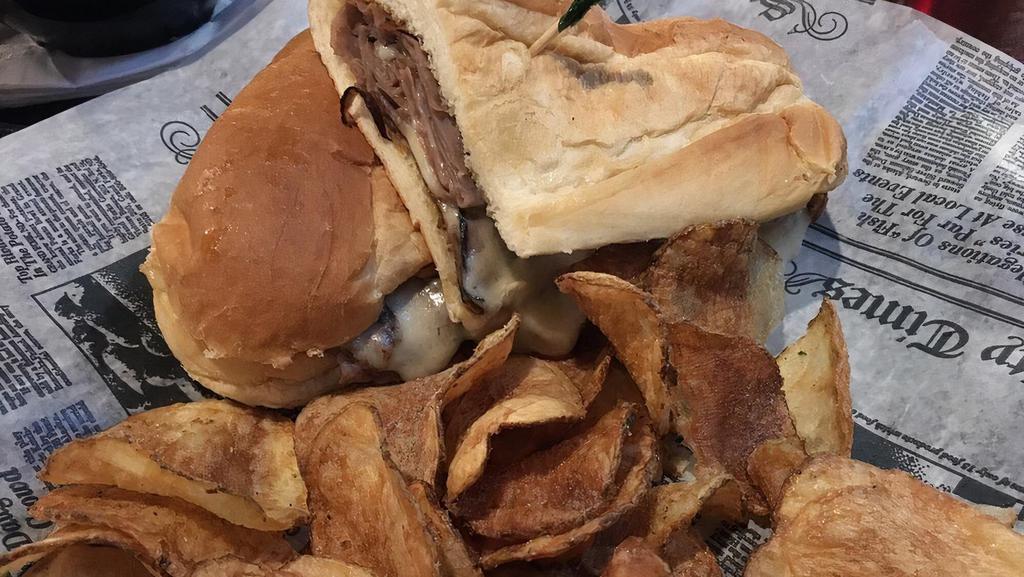 Detroit'S French Dip · Thinly slice roast beef topped with melted swiss cheese served on a grilled sub bun with one cup of au-jus.