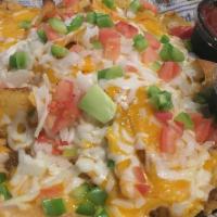 Cass Corridor Nachos · Tortilla chips topped with your choice of seasoned ground beef or chicken, white queso chees...