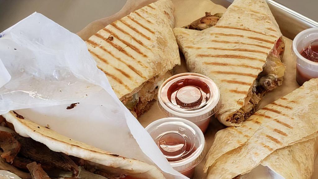 Mixed Beef & Chicken Shawarma Wrap · The best of both worlds! Beef and Chicken Shawarma grilled to perfection. Served with Tomato, pickles, potato  and garlic sauce.