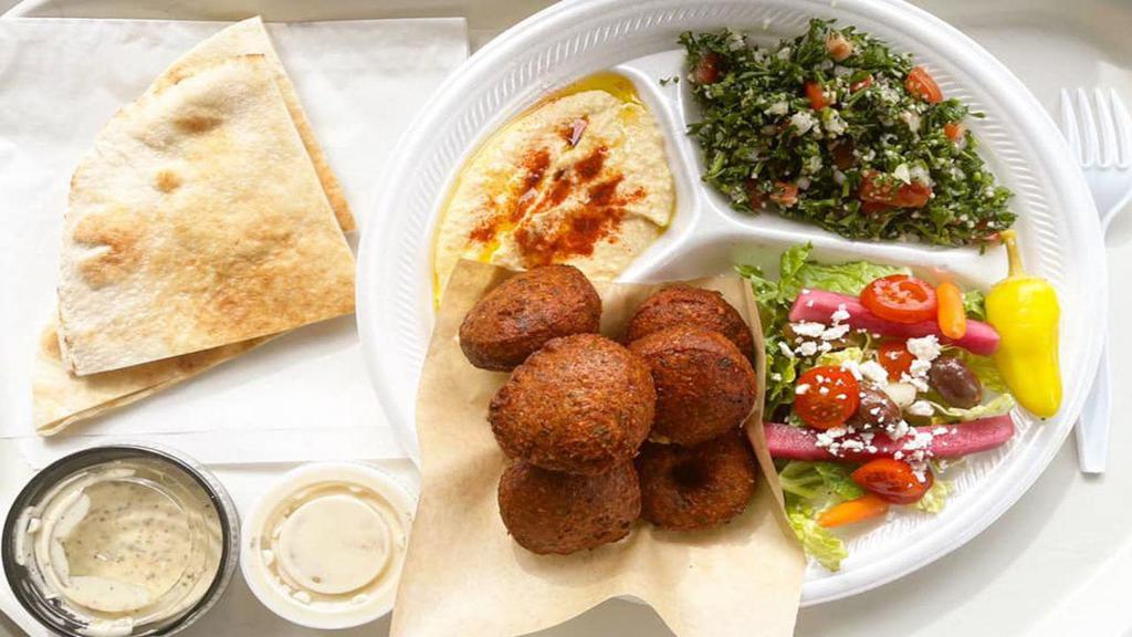 Falafel Platter · Vegetarian pies made of chick peas, parsley,  onions, garlic and special spices.
Served with rice, hummus, tabouli, a side of pita and tahini sauce.