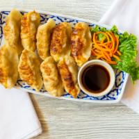 Pot Stickers · Ground pork cabbage, green onion, ginger, egg, salt, sesame oil served with soy sauce on the...