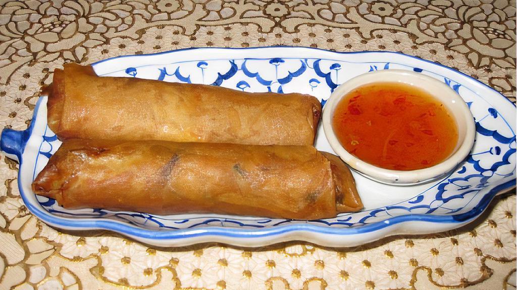 Siam Spring Rolls (2) · Deep-fried with stuffed ground pork, bean thread, and a mixture of vegetables, served with sweet chili sauce.