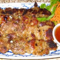 Thai Bbq Chicken · Chicken marinated with Thai herbs on a stick, grilled to perfection served
with chili sauce.
