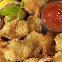 Butterfly Shrimp · Deep-fried shrimp served with sweet and sour sauce.
