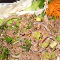 Larb · Spicy. Choice of chicken, pork, beef, or shrimp mixed with roasted rice powder, mint leaves,...